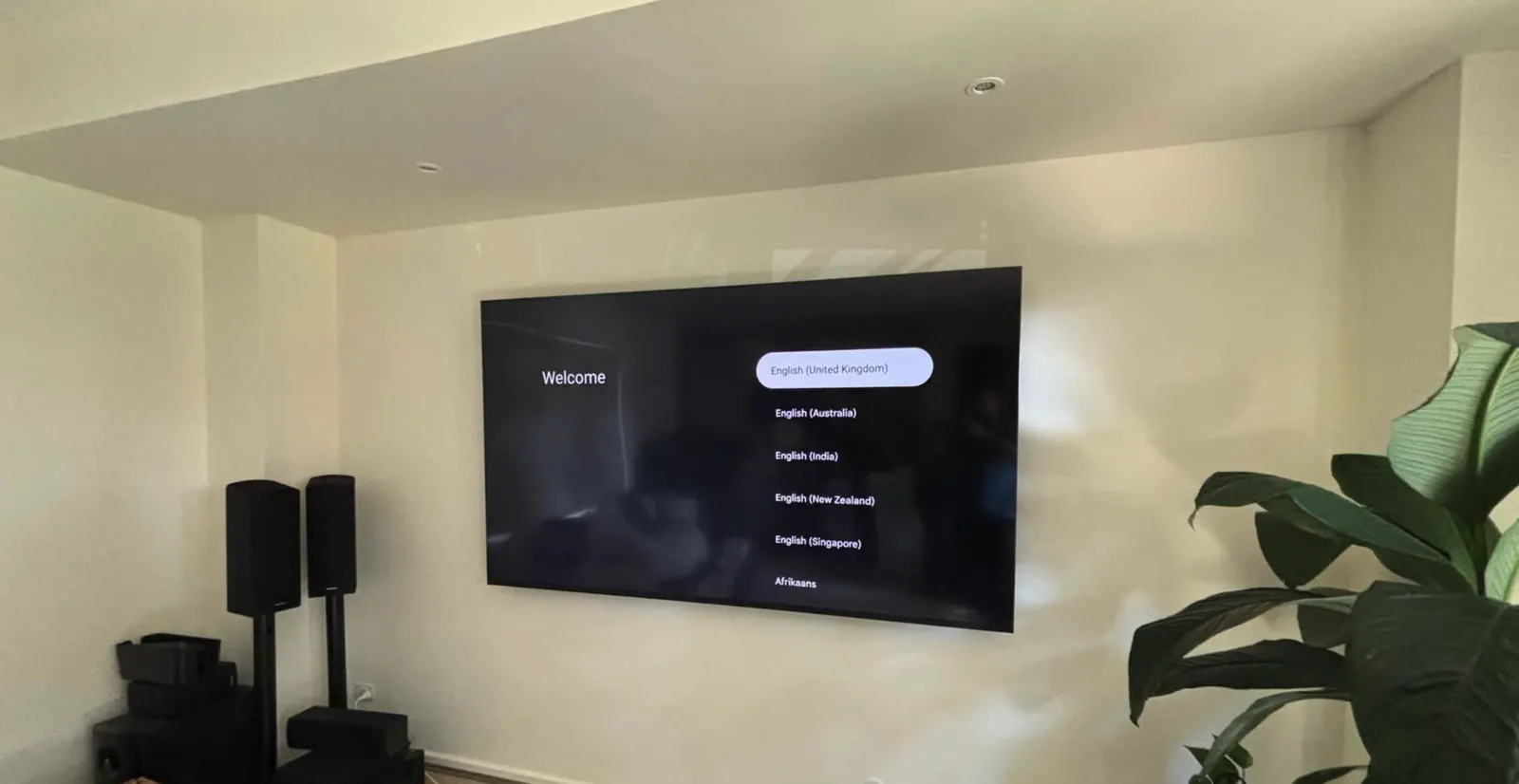 Large TV and home theatre speakers mounted in a living room
