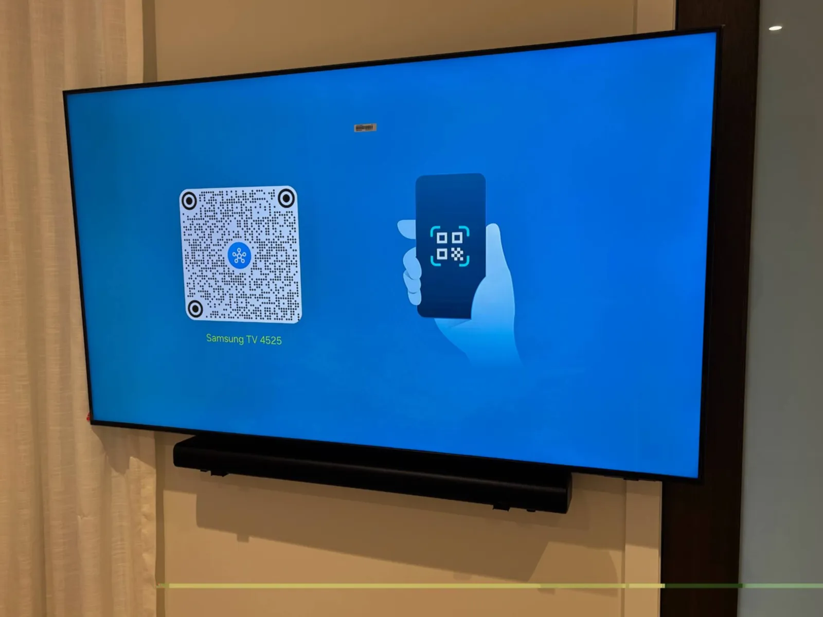 Samsung TV and soundbar mounted in a family bedroom