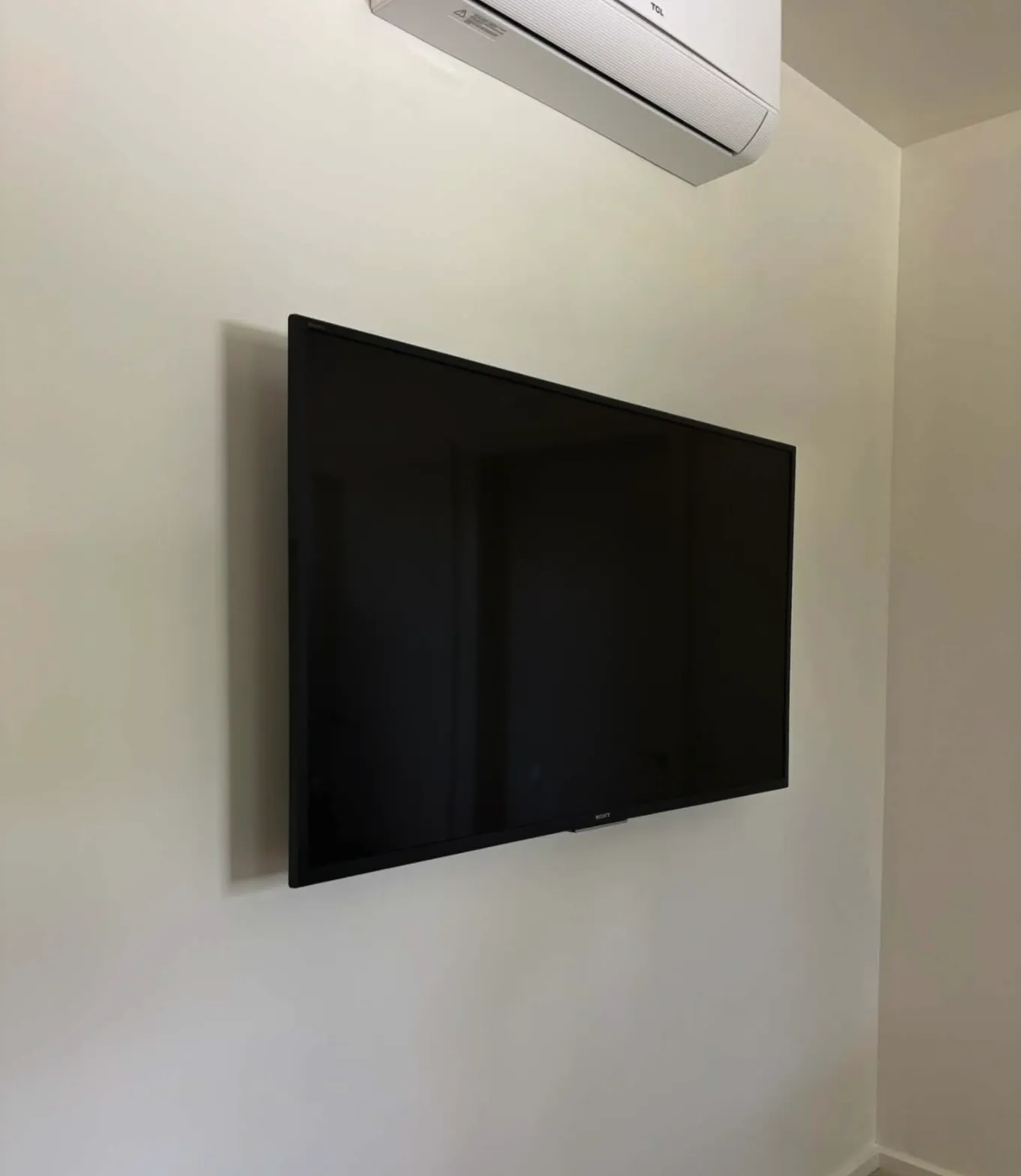 TV mounted with clean finish in a new build bedroom